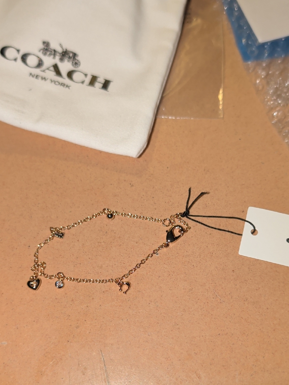Coach Gold Heart Charm Bracelet with Crystal Accent